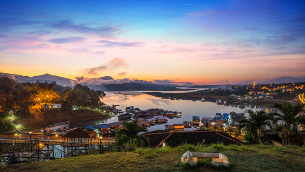 Scenic view of Sangkhlaburi’s wooden bridge surrounded by hills and calm water