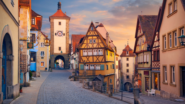 Rothenburg ob der Tauber medieval village in Germany with half-timbered houses and cobblestone street at sunset