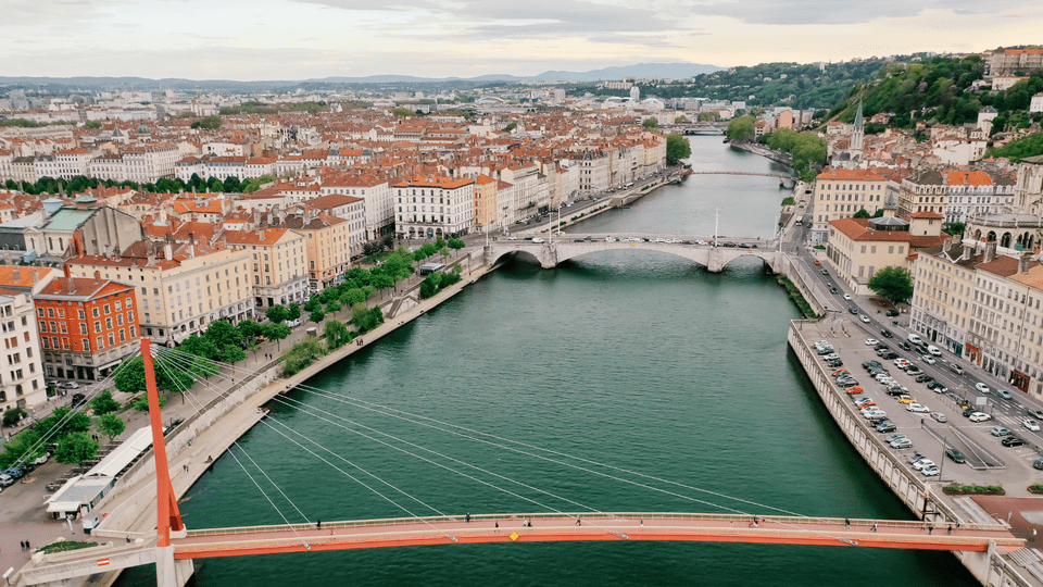 Aerial view of Lyon old town with Saône river, bridges, and terracotta rooftops in France.